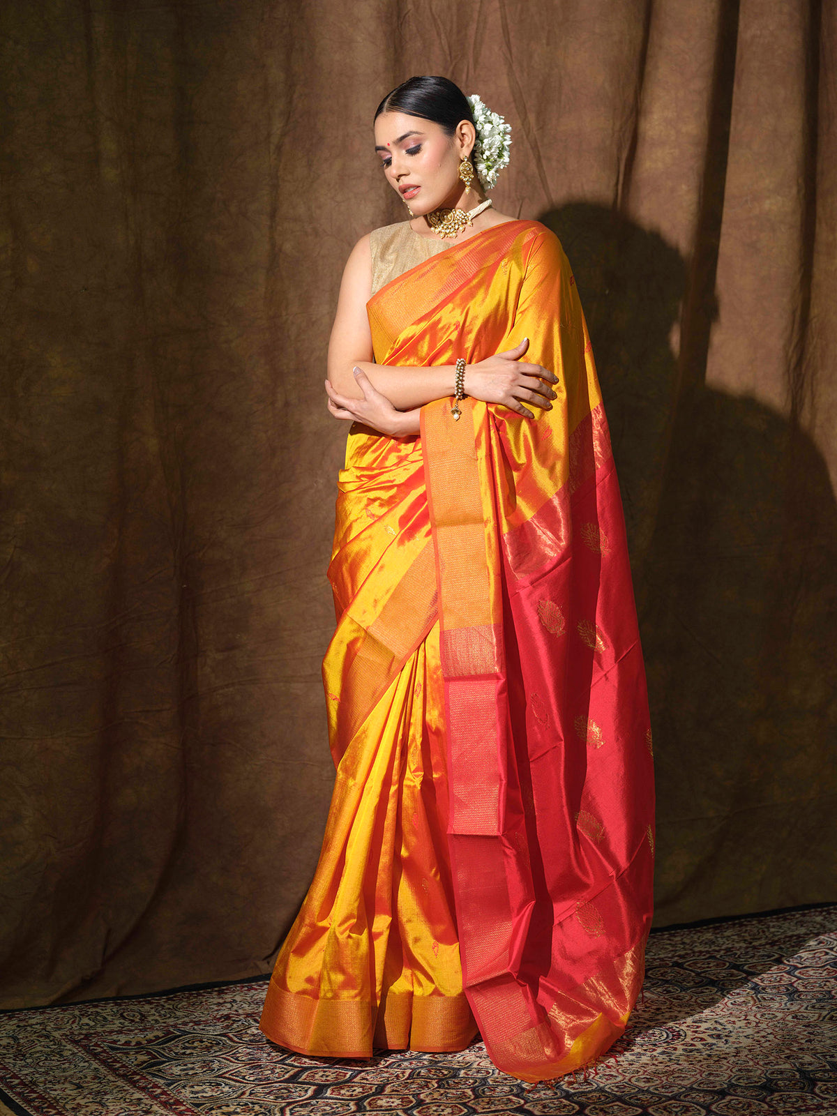 Mustard Yellow Maheshwari silk saree with red accents.