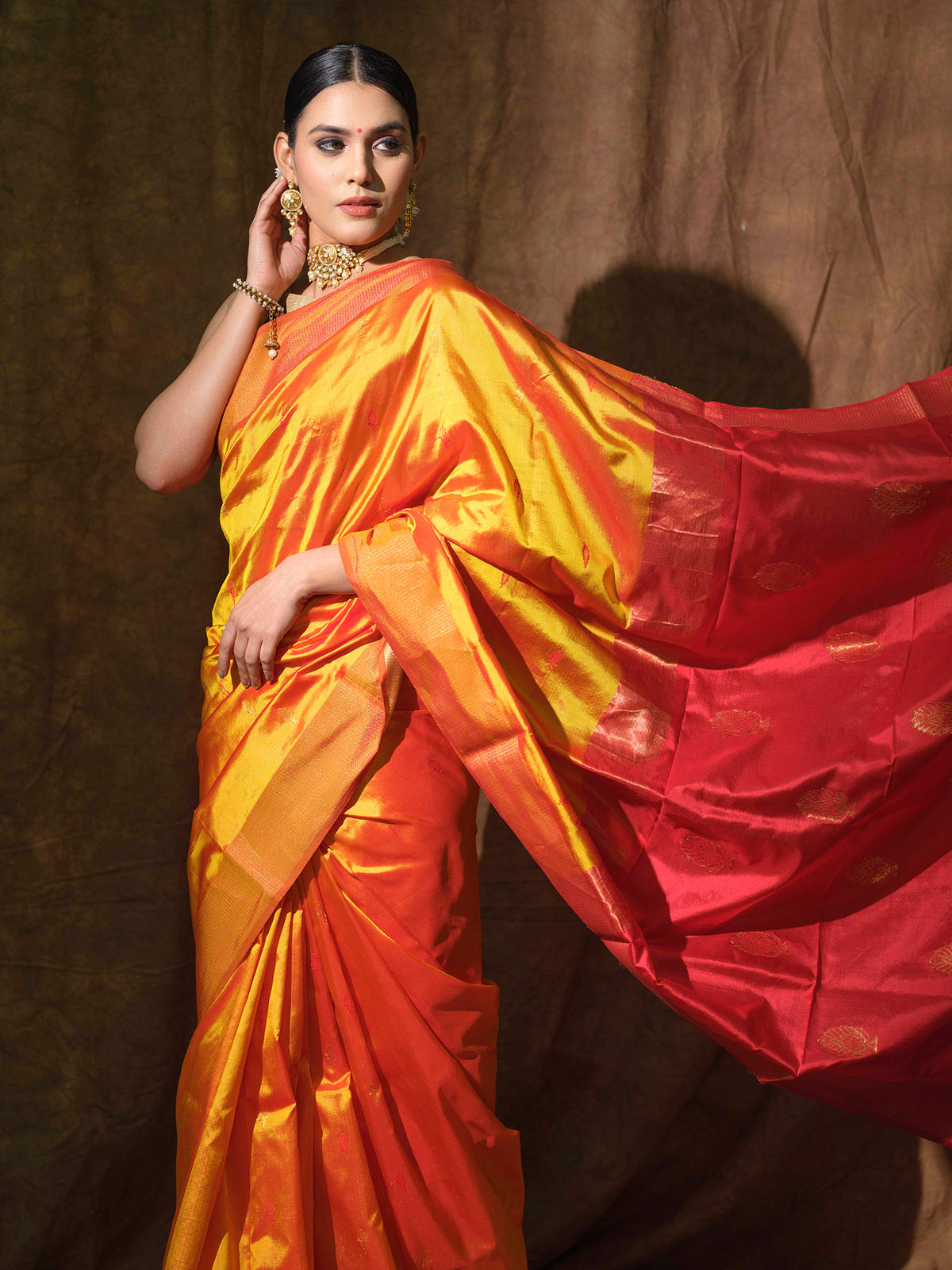 Mustard Yellow Maheshwari silk saree with red accents.