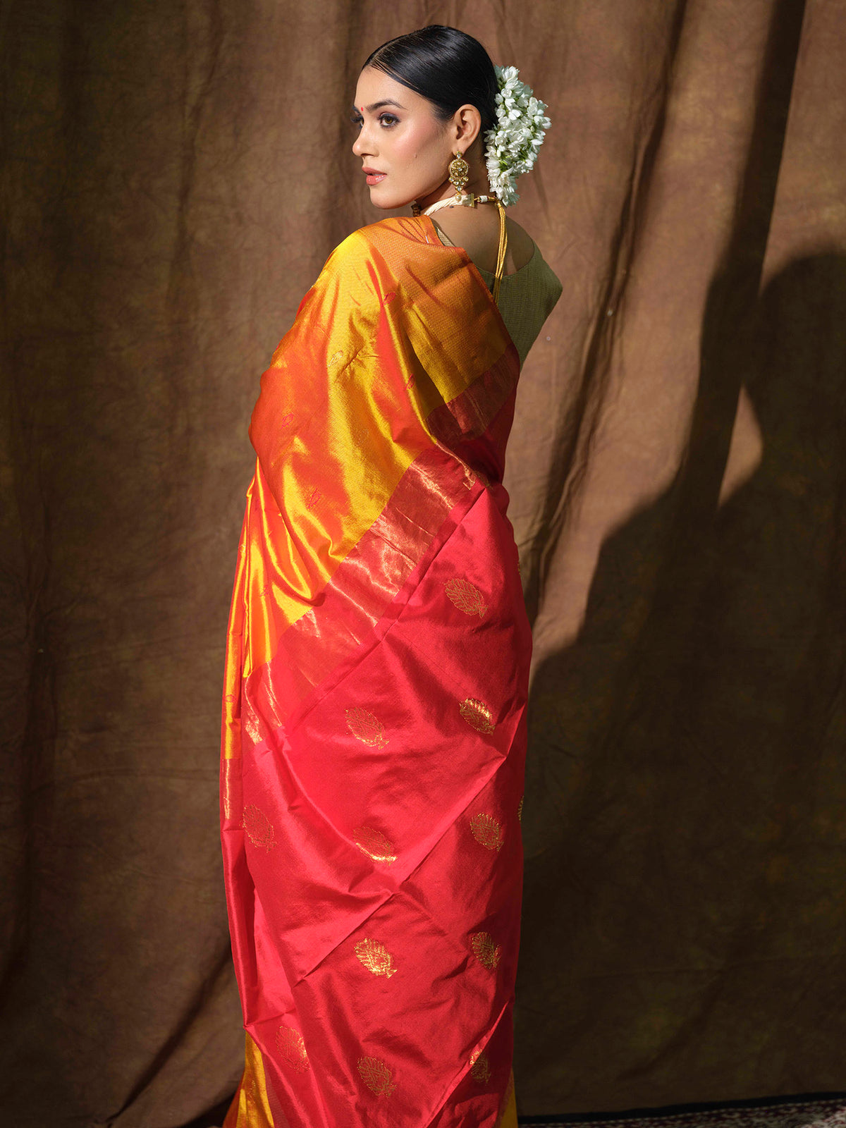 Mustard Yellow Maheshwari silk saree with red accents.