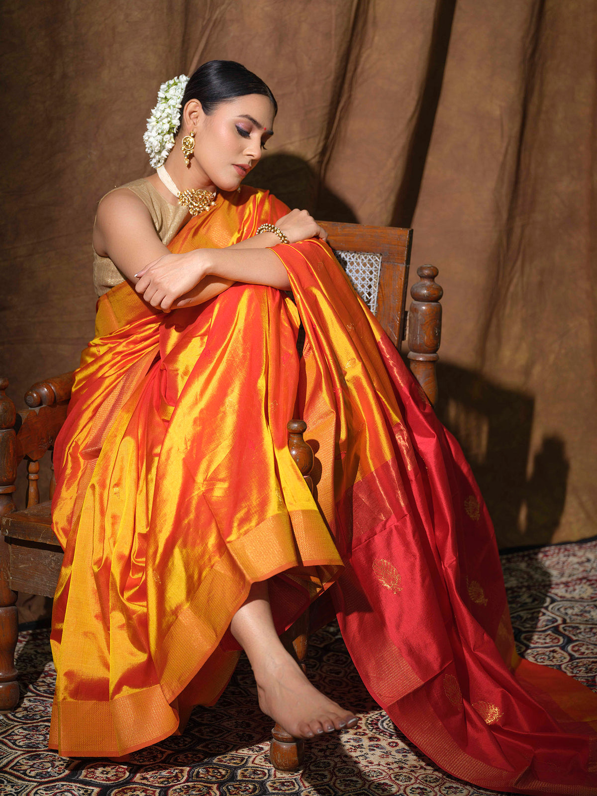 Mustard Yellow Maheshwari silk saree with red accents.