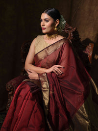 Maroon Maheshwari cotton silk saree with shimmering bronze accents.