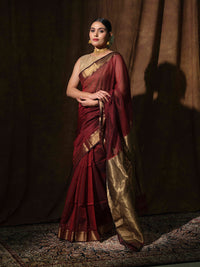 Maroon Maheshwari cotton silk saree with shimmering bronze accents.