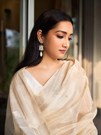 Off-white Maheshwari cotton silk saree with silver zari.