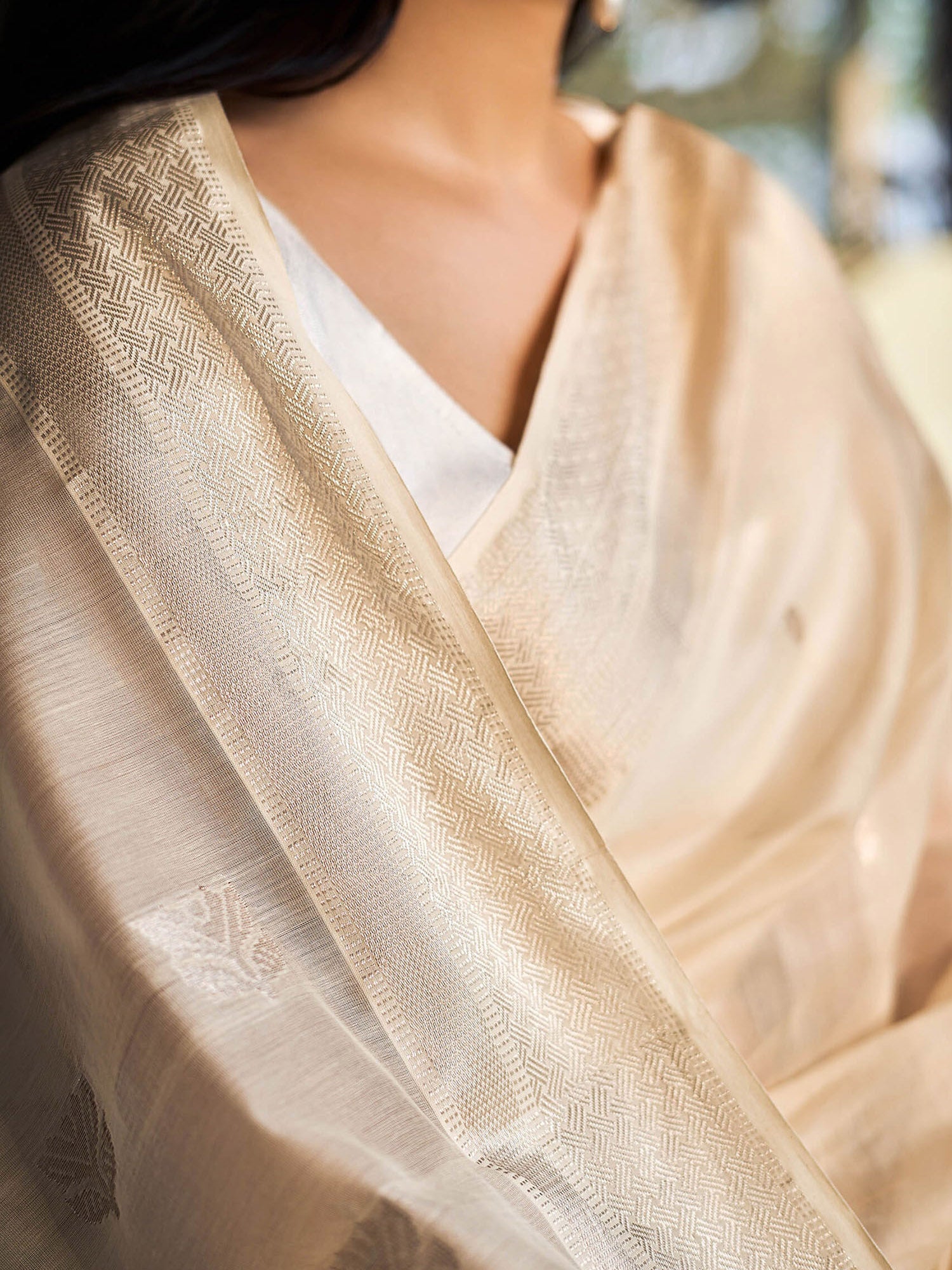 Off-white Maheshwari cotton silk saree with silver zari.