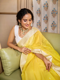 Lemon yellow and ivory Maheshwari cotton silk saree with silver zari.