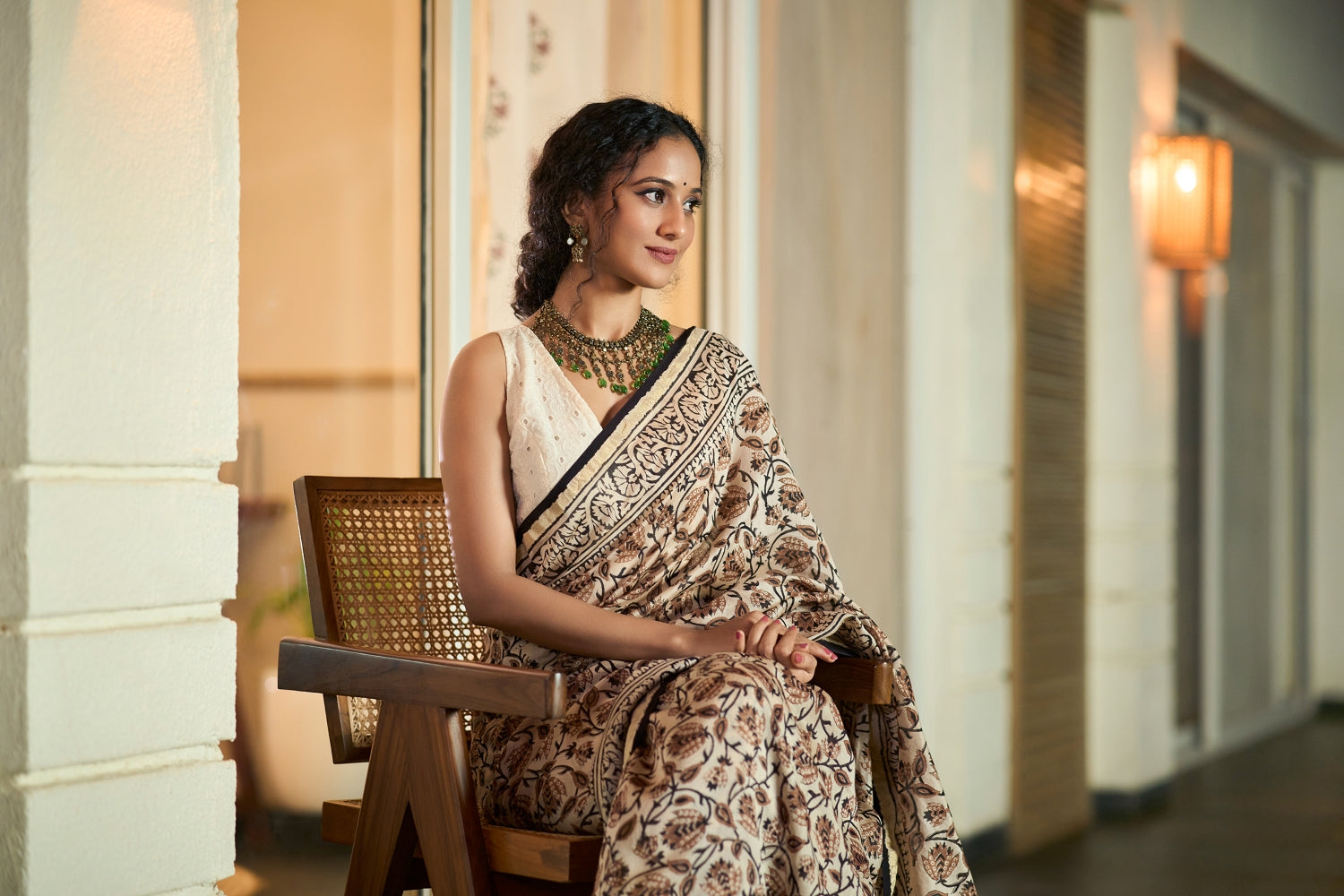 A kalamkari print saree in beige color, from the everyday wear saree collection by Mrida