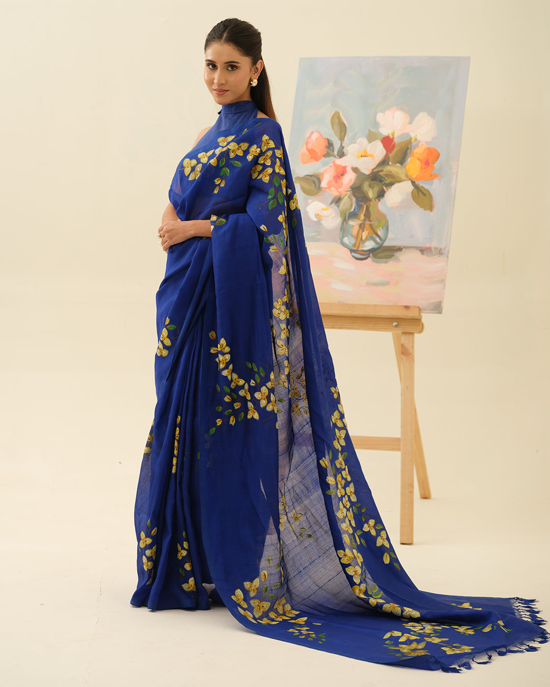 Bougainvillaea Wall handpainted saree by Mrida featuring yellow and white floral motifs on an indigo base
