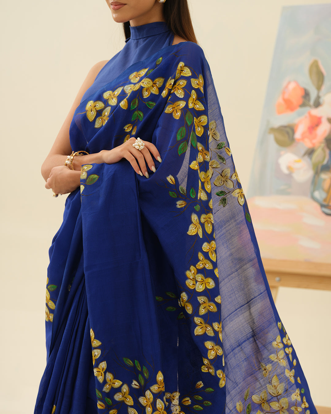 Artisan handpainted yellow and white floral motifs on the Bougainvillaea Wall saree by Mrida