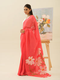 Champa Blush handpainted saree by Mrida featuring white champa flowers on a coral base