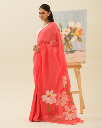 Champa Blush handpainted saree by Mrida featuring white champa flowers on a coral base