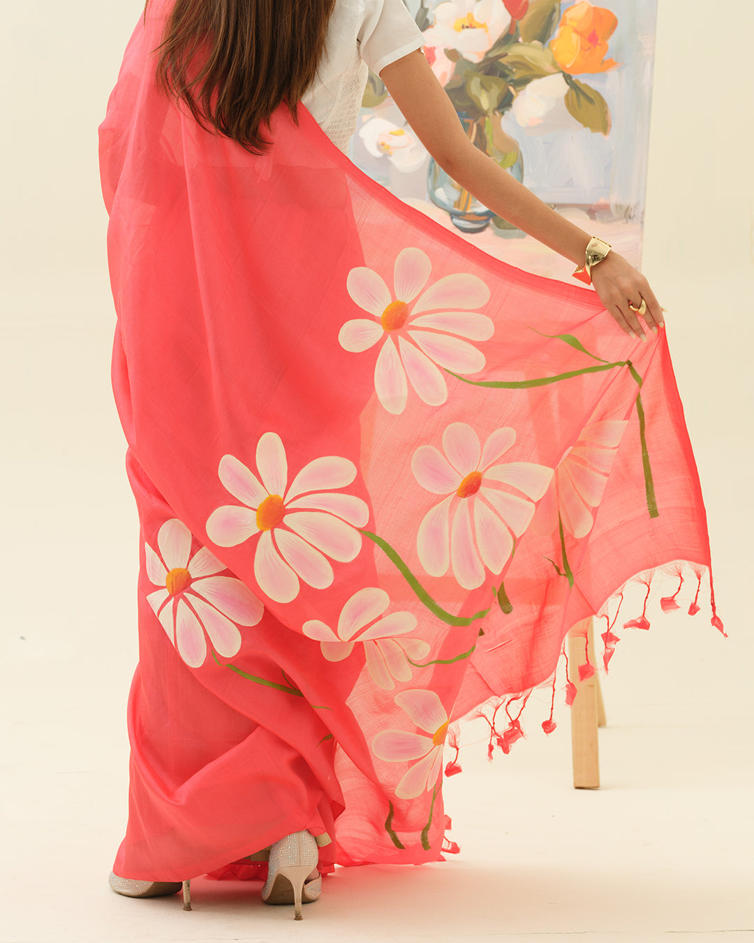 Artisan handpainted white champa flower motifs on the Champa Blush saree by Mrida