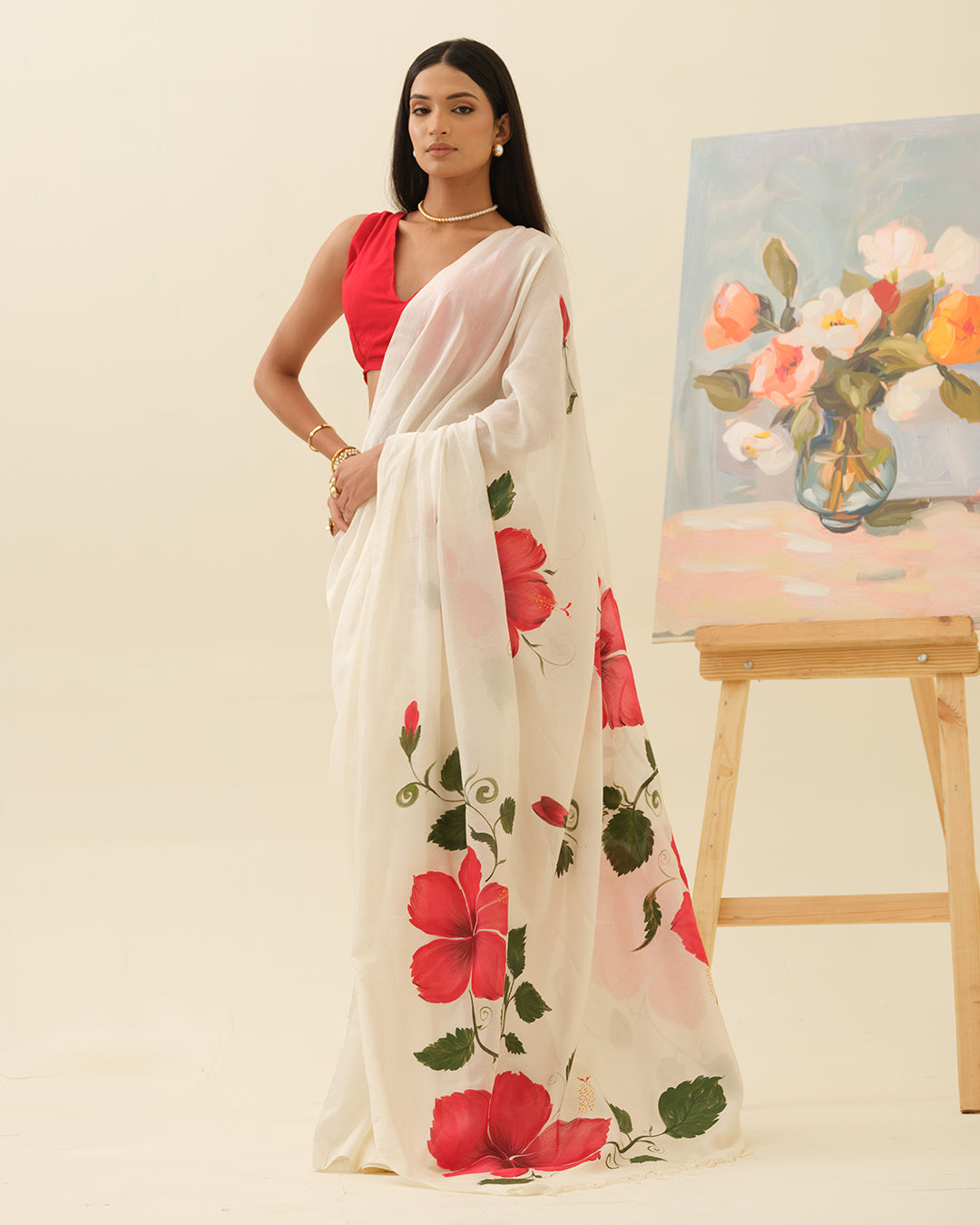 Crimson Hibiscus handpainted saree by Mrida featuring red hibiscus flowers on an ivory base