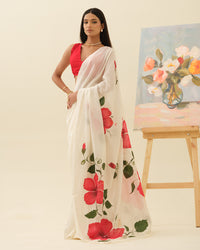 Crimson Hibiscus handpainted saree by Mrida featuring red hibiscus flowers on an ivory base