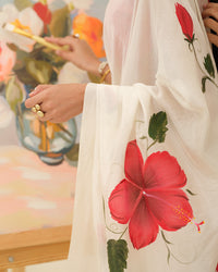 Crimson Hibiscus floral saree styled for weddings and festive celebrations