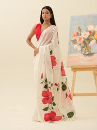 Crimson Hibiscus handpainted saree by Mrida featuring red hibiscus flowers on an ivory base
