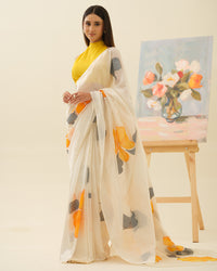 Golden Hibiscus handpainted saree by Mrida with yellow hibiscus flowers on a white base