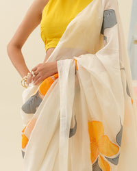 Close-up of handpainted hibiscus flowers on the Golden Hibiscus saree