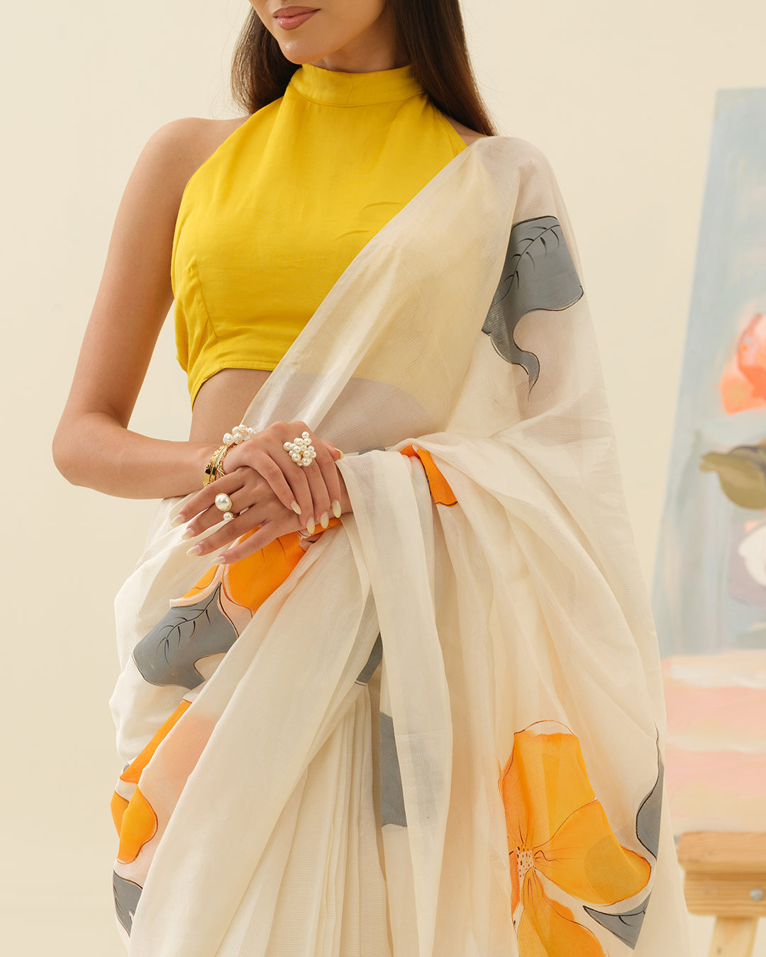 Detailed view of yellow hibiscus artwork on the Golden Hibiscus saree