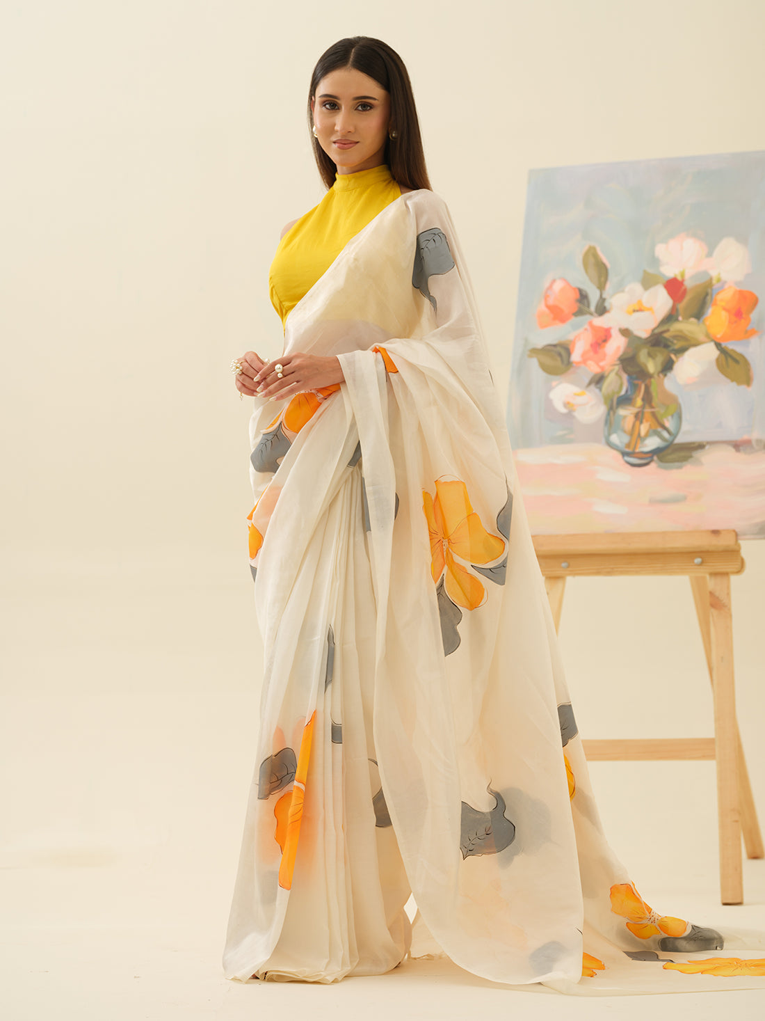 Golden Hibiscus handpainted saree by Mrida with yellow hibiscus flowers on a white base