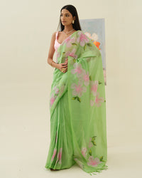 Morning Bloom handpainted saree by Mrida featuring pale pink flowers on a soft mint green base