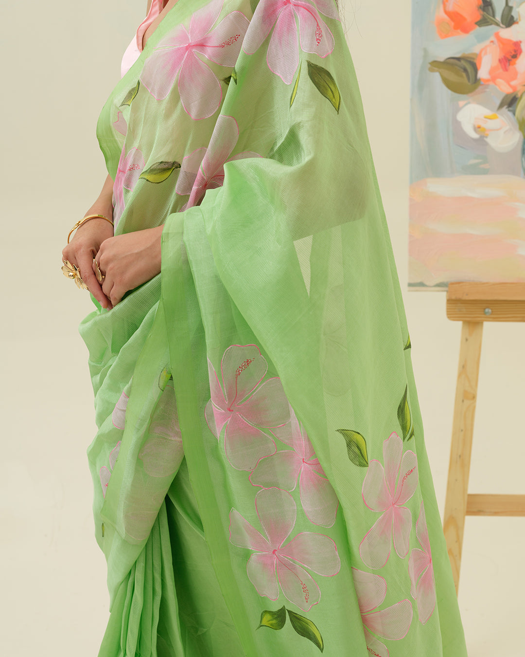 Close-up of handpainted floral artwork on the Morning Bloom saree