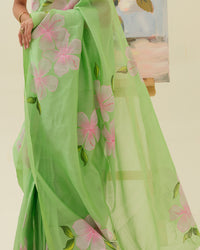 Artisan handpainted pink floral motifs on the Morning Bloom saree by Mrida
