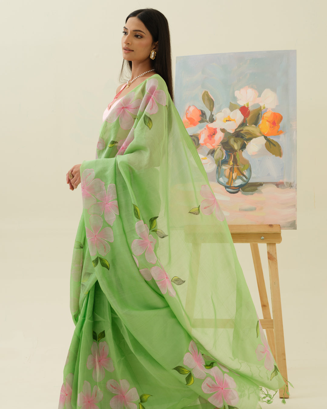 Artisan handpainted pink floral motifs on the Morning Bloom saree by Mrida