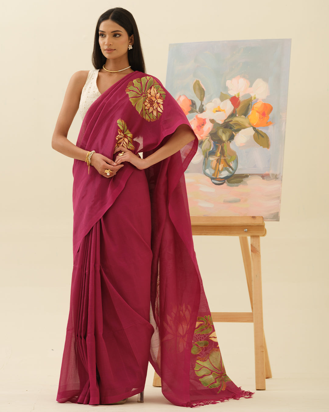 Pink Lotus handpainted saree by Mrida featuring ivory lotus blooms on a deep fuchsia base