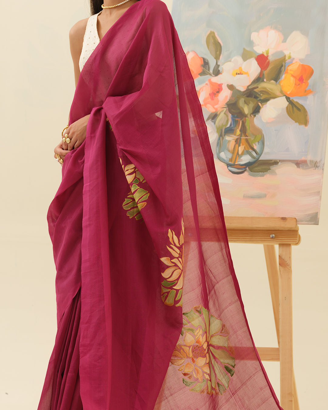 Close-up of handpainted lotus artwork on the Pink Lotus saree