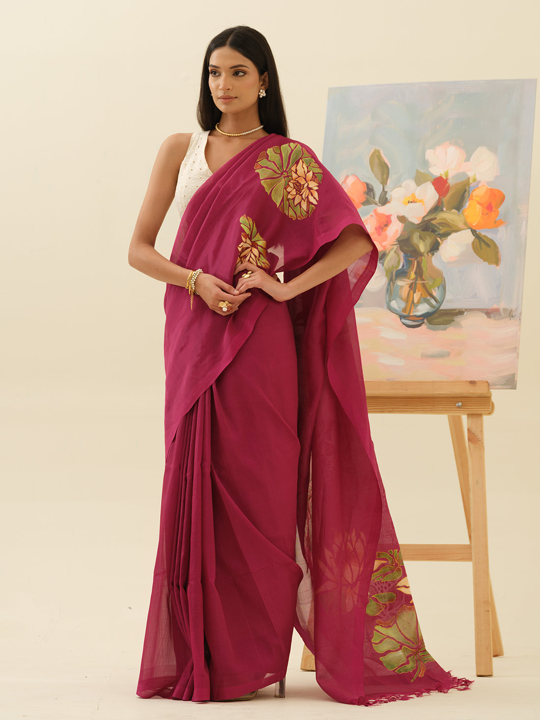 Pink Lotus handpainted saree by Mrida featuring ivory lotus blooms on a deep fuchsia base