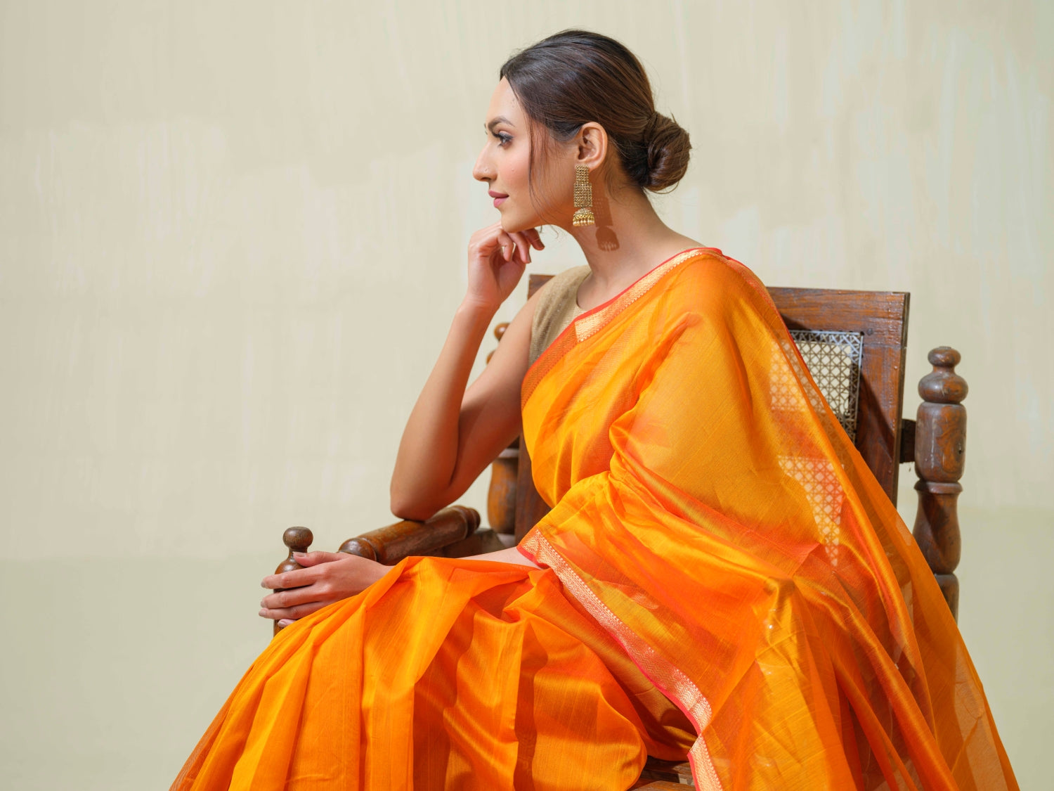 A Saffron Maheshwari Saree with Jute work Pallu, from Saadgi Collection by Mrida