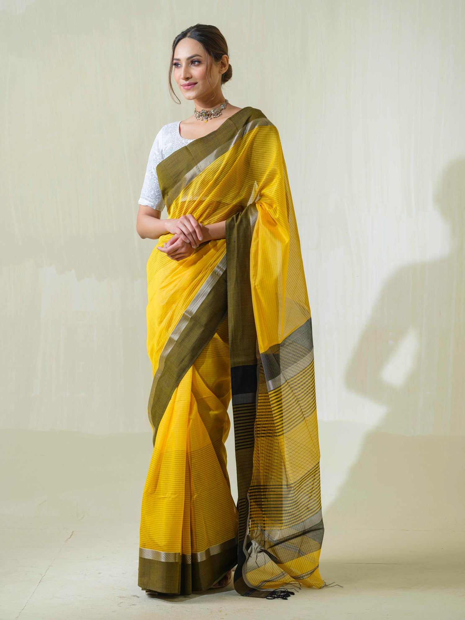 Bright Yellow Maheshwari Saree with Silver Zari, a premium handloom saree by Saadgi Collection from Mrida